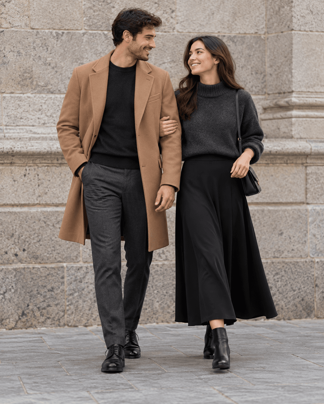 AI-generated two fictional adults beside a generic stone wall, one in camel coat and charcoal trousers, partner in charcoal knit and dark skirt.