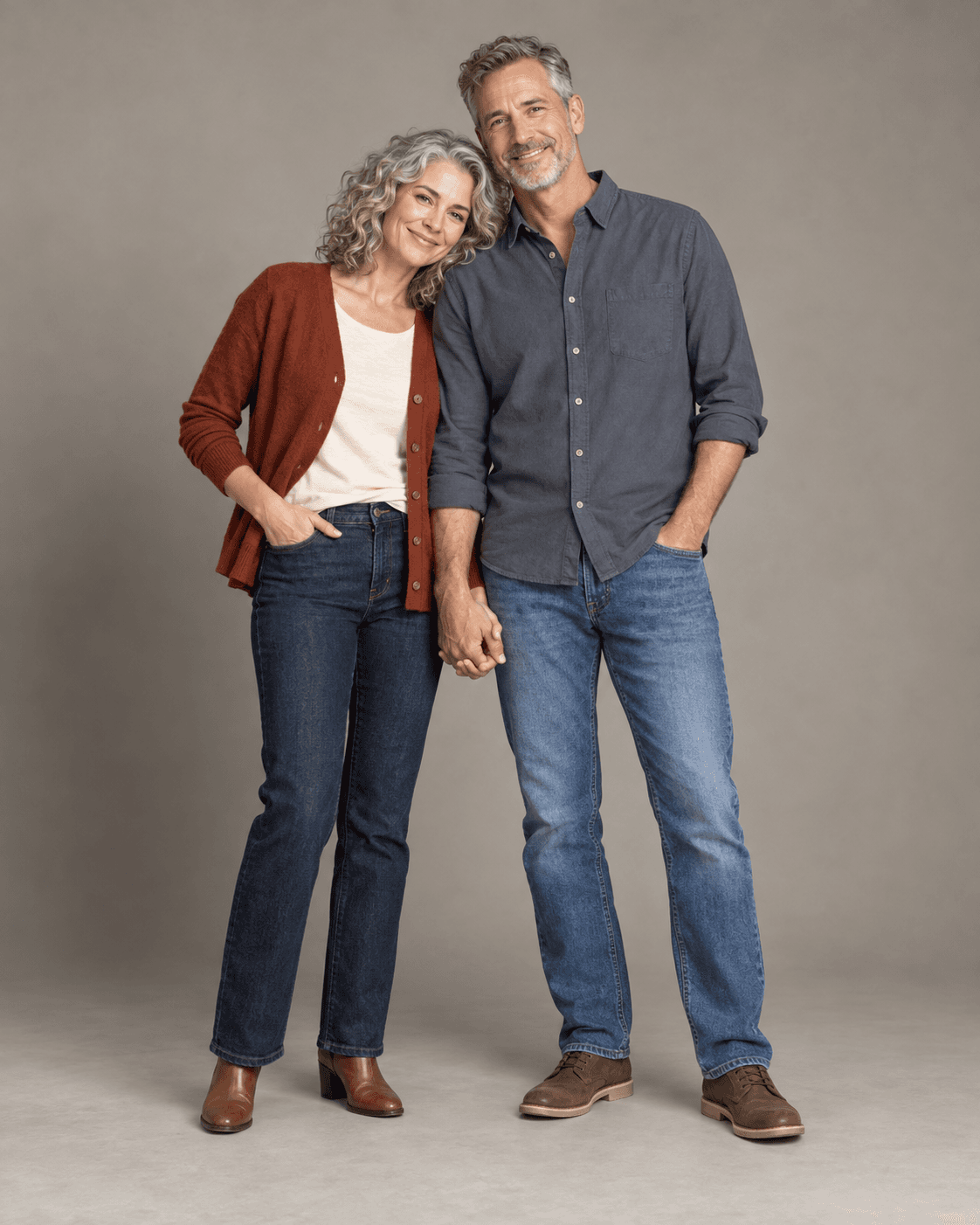 AI-generated full-length studio concept of two fictional adults: Person A wears a rust cardigan and dark denim; Person B wears a slate cotton shirt and medium-blue jeans.