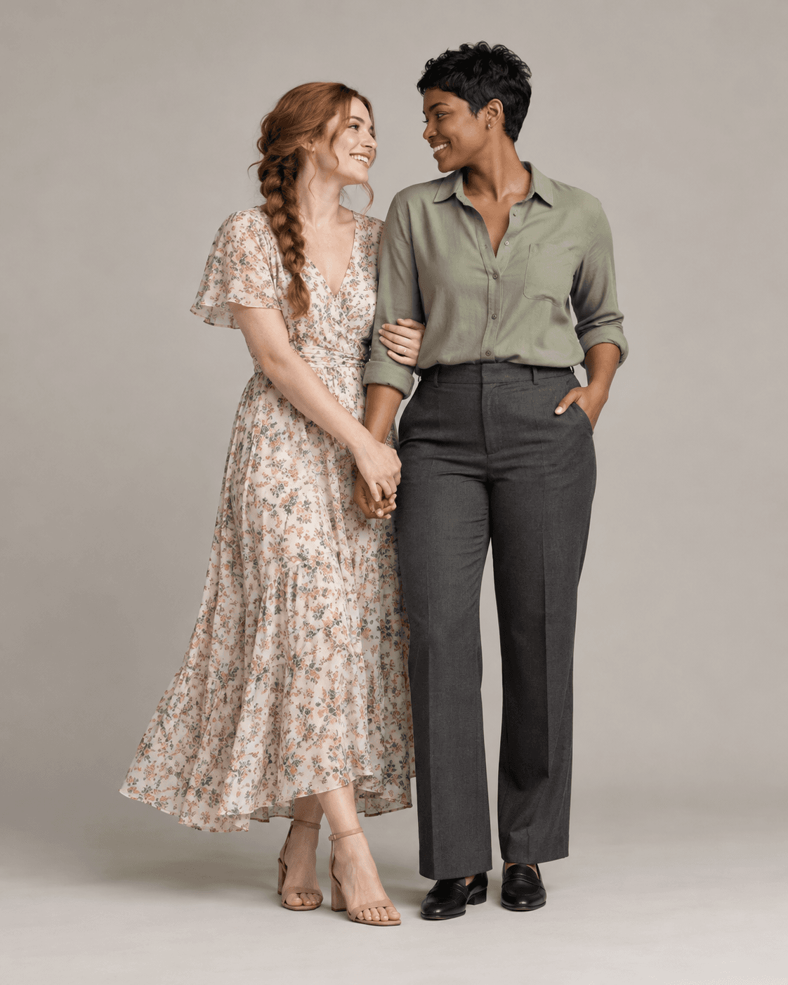 AI-generated full-length studio concept of two fictional adults: Person A wears a muted floral dress; Person B wears a plain sage shirt and charcoal trousers.